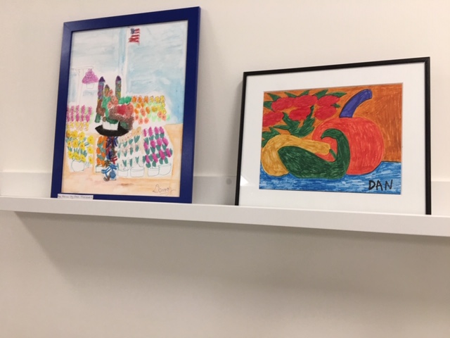 Two framed pieces of Kennedy-Donovan Center Artwork