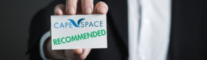 Man holding business card that says "CapeSpace Recommended"